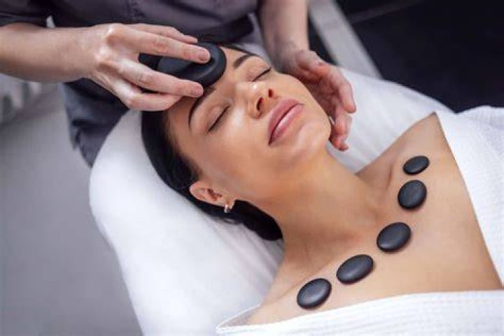 What is the history behind hot stone massage?